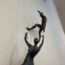 Adam Climbing Man Sculpture